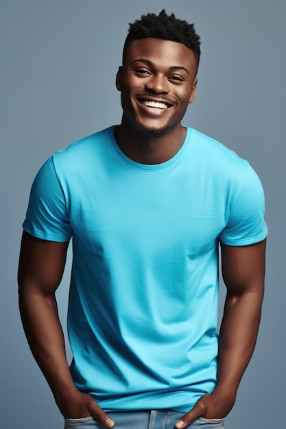 A man in a blue shirt smiles in front of a blue background