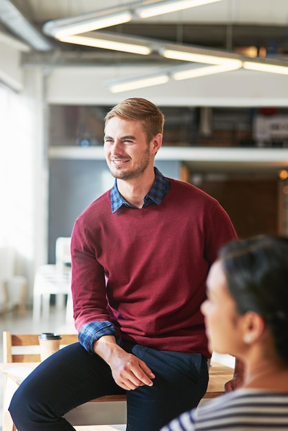 Man business people and office with focus learning and development of career for teamwork success Modern office woman and coworker sitting on table for marketing team building or conversation