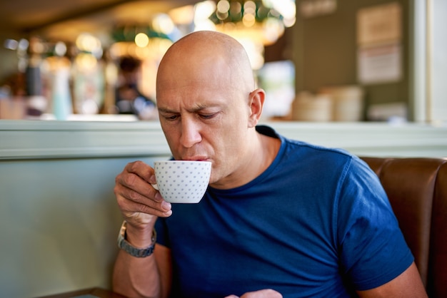 Man in a cafe at breakfast