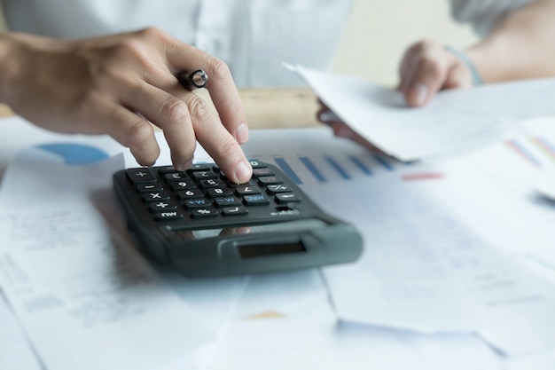 Man calculating domestic bills at home