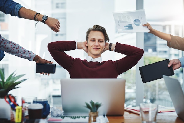 Photo man calm and multitasking in office with hands staff and documentation for deadline at startup person peace and relax with paperwork charts and happy for time management with reading on laptop