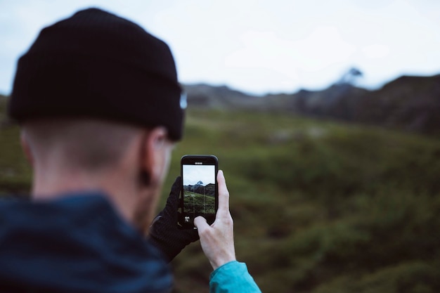 Man capturing a view of nature