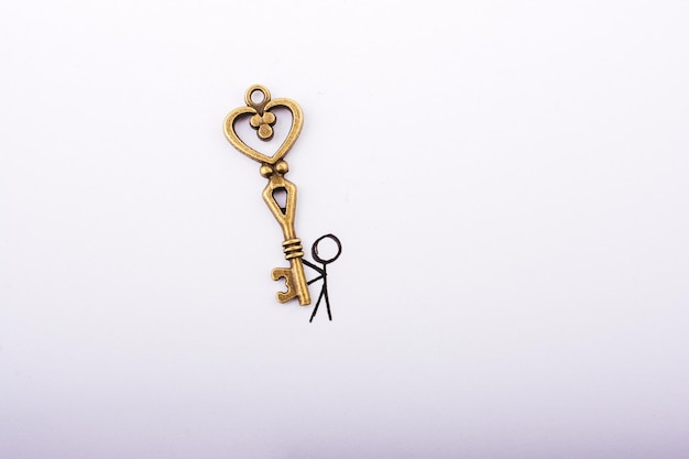 Man carrying a retro style heart shaped key as love concept