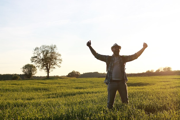 A man in casual clothes is a traveler in the open spaces