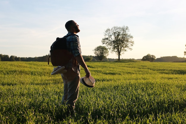 A man in casual clothes is a traveler in the open spaces