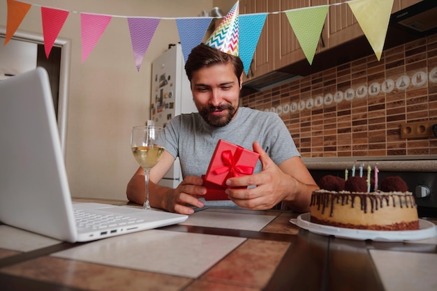 Man celebrating birthday online in quarantine time