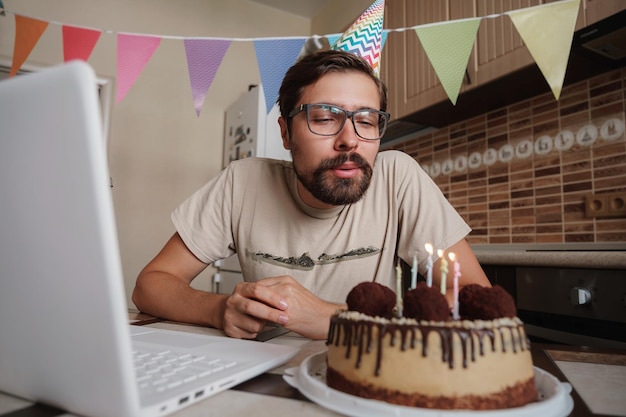 Man celebrating birthday online in quarantine time