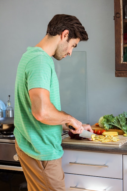 Man chopping vegetables