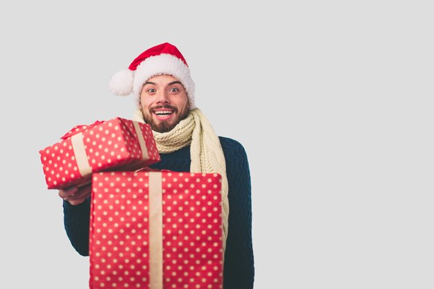 Man in a Christmas hat on a gray background