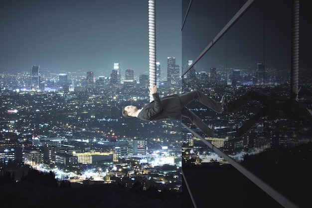 Man climbing building at night