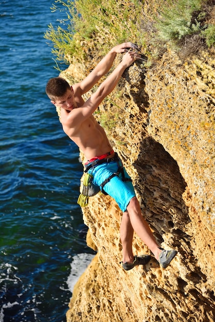 Man climbing up on mountain