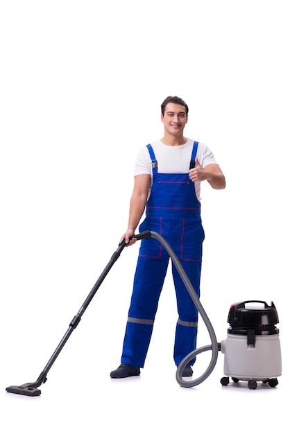 Man in coveralls doing vacuum cleaning on white