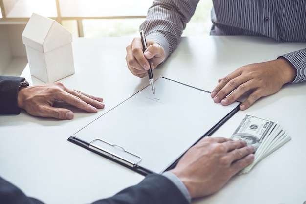 Man customer signing buying home policy document agreement, successful loan contract