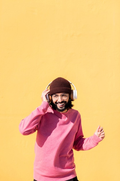 Man dancing happy listening music in headphones