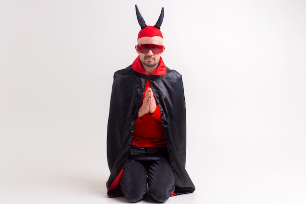 Man in devil masquerade costume posing.