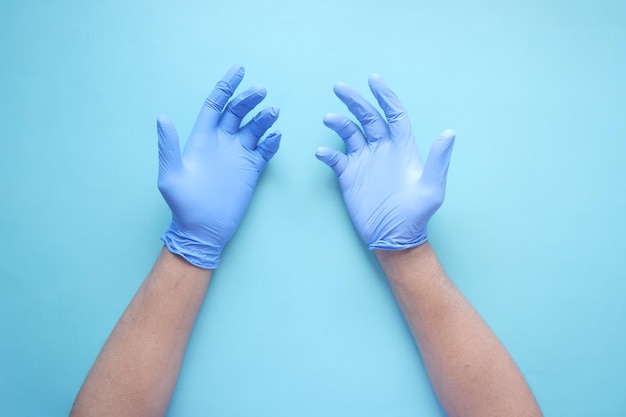 Man doctor wears medical gloves close up