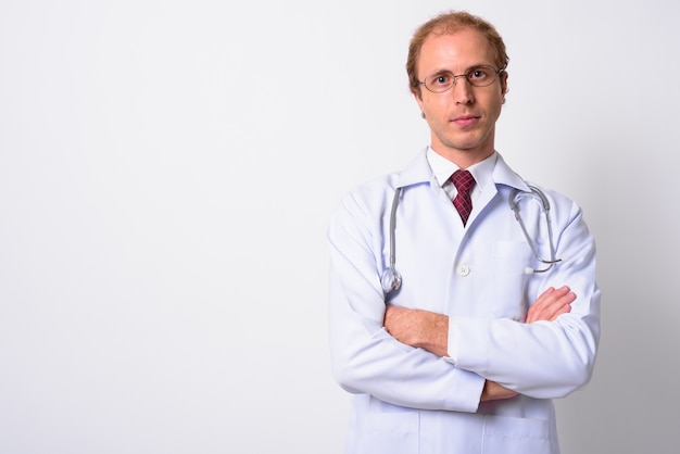  man doctor with blond hair wearing eyeglasses against white wall