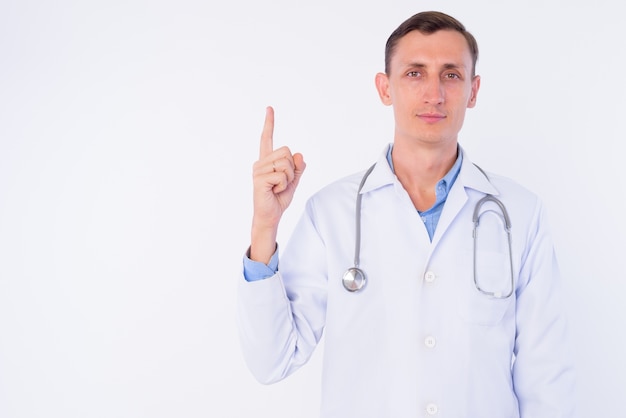  man doctor with stethoscope around neck isolated against white wall