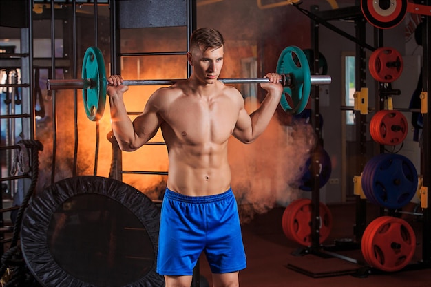 Man doing exercises with barbell