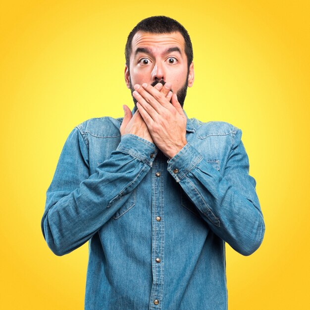 Man doing surprise gesture on colorful background