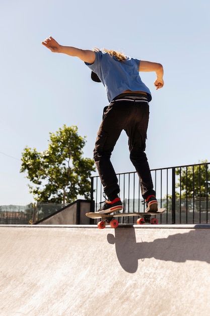 Man doing trick on skateboard full shot