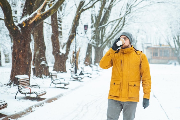 Man drinking coffee in city park lifestyle casual