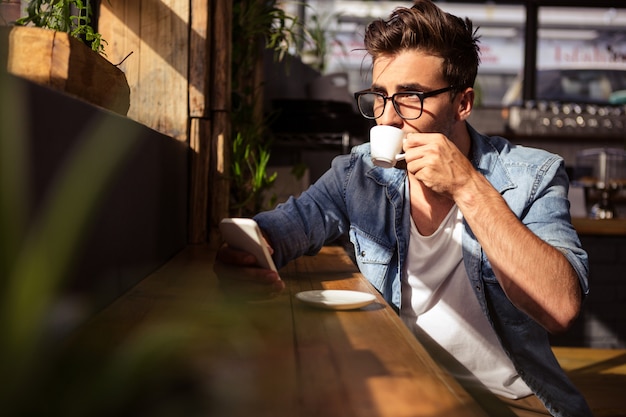 Man drinking a cup of coffee