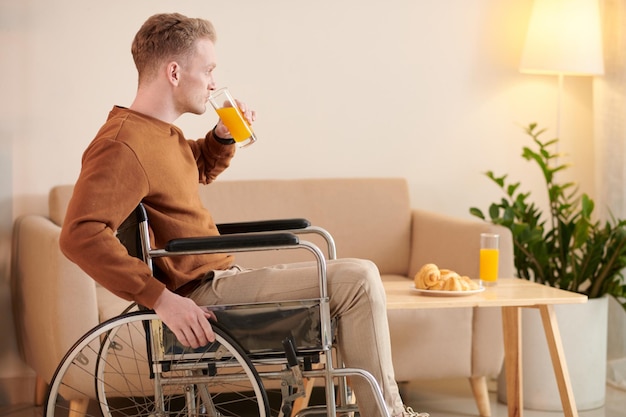 Man Drinking Orange Juice