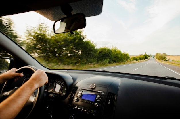 Man driving car on road