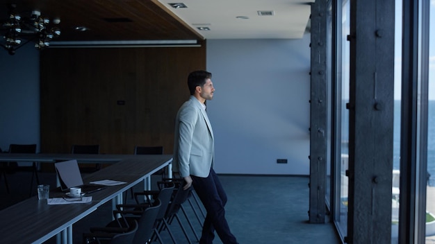 Man enjoying break conference room Manager making pause and looking distance