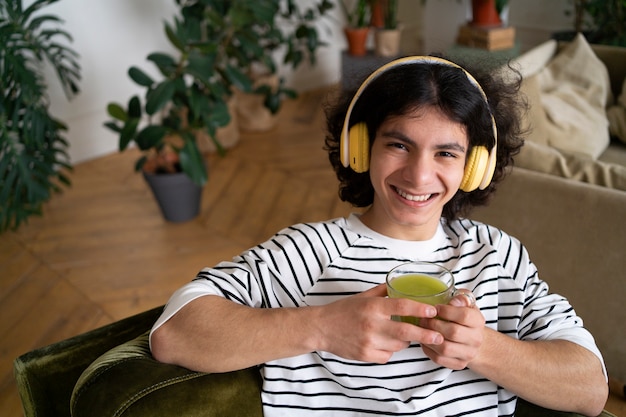 Man enjoying a cup of matcha tea at home