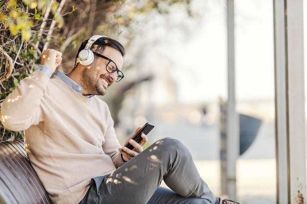 A man enjoying music in a park