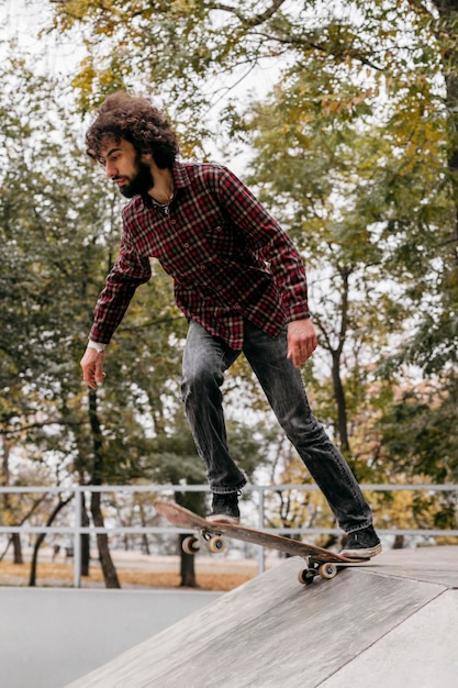 Man enjoying skateboarding in the city park