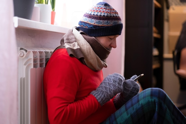 Photo man feeling cold at home with home heating trouble