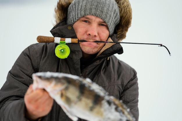 Man fishing alone in the winter