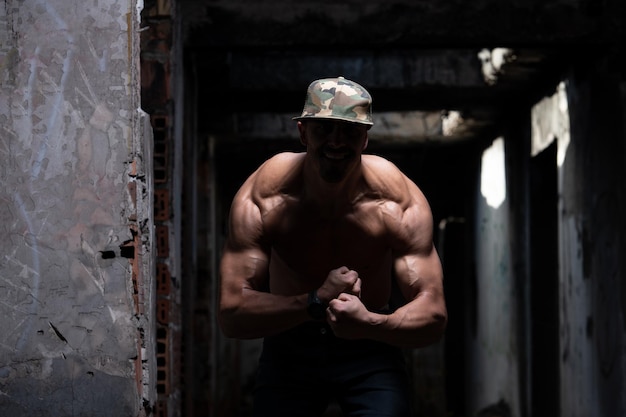 Man Flexing Muscles in Ruins