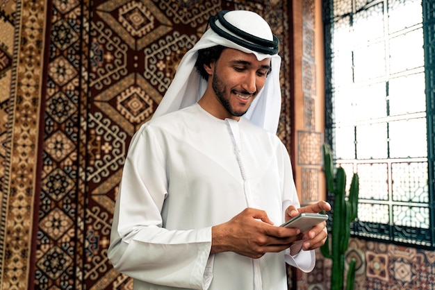 Man from emirati wearing kandura outfit