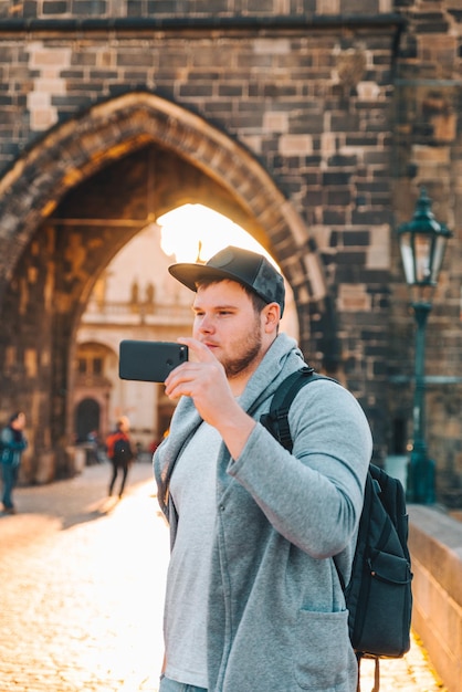 Man in front of charles bridge in prague