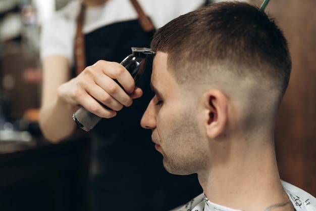 Man getting his hair cut at barbershop