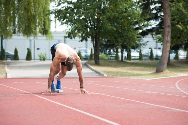 Man Getting Ready to Start Running