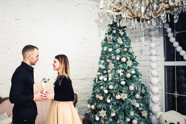 Man gives gift to girl for Christmas