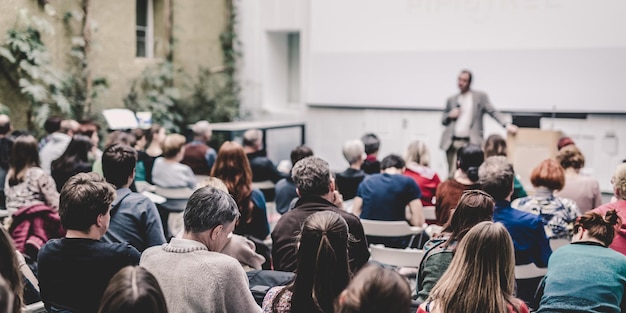 Man giving presentation in lecture hall at university