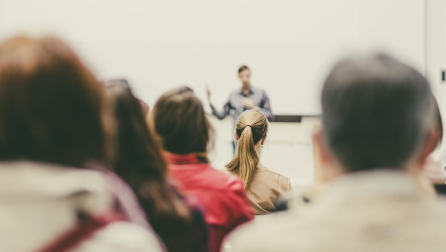 Man giving presentation in lecture hall at university