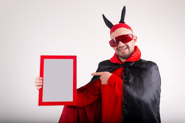 man in halloween costume demonstrating empty nameplate