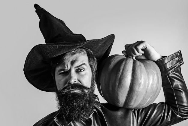 Man in Halloween costume with pumpkin