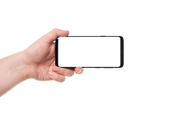 Man hand holding the black smartphone blank screen isolated on white 