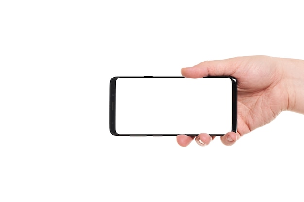 Man hand holding the black smartphone blank screen with modern frameless design isolated on white background