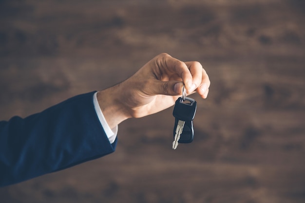 Man hand holding car key