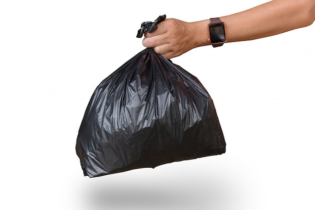 Man hand holding garbage bag isolated on white with clipping path