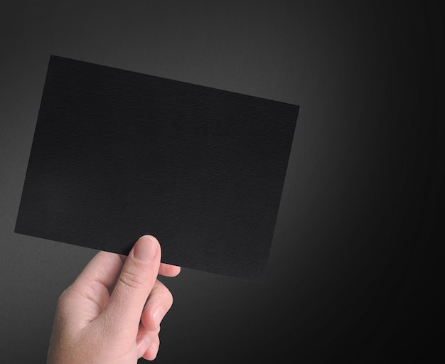 Man hand holding a invitation card isolated